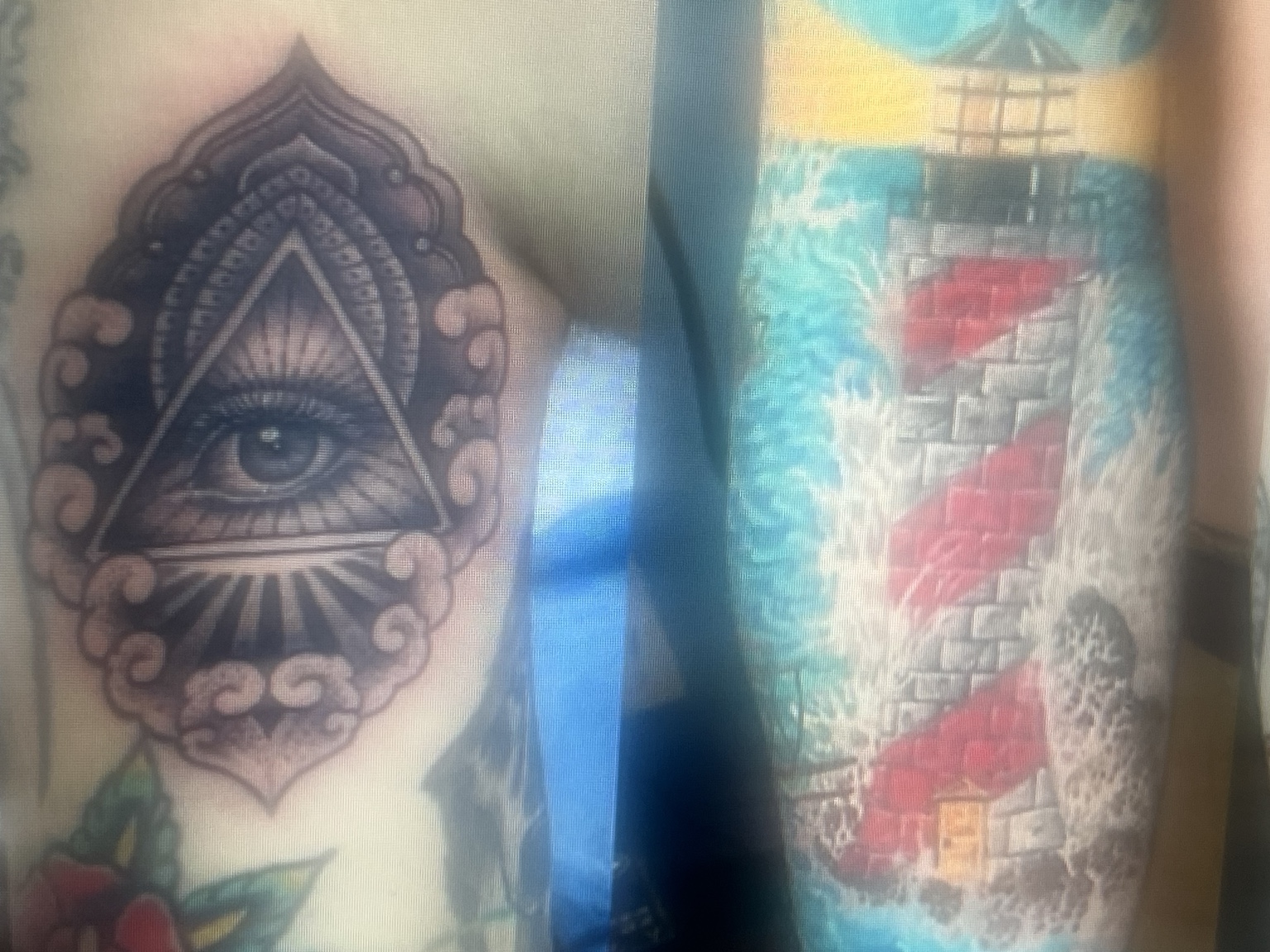 Eye tattoo with ornamental black and grey detail